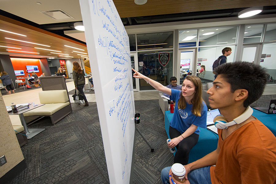 library commons students using white board