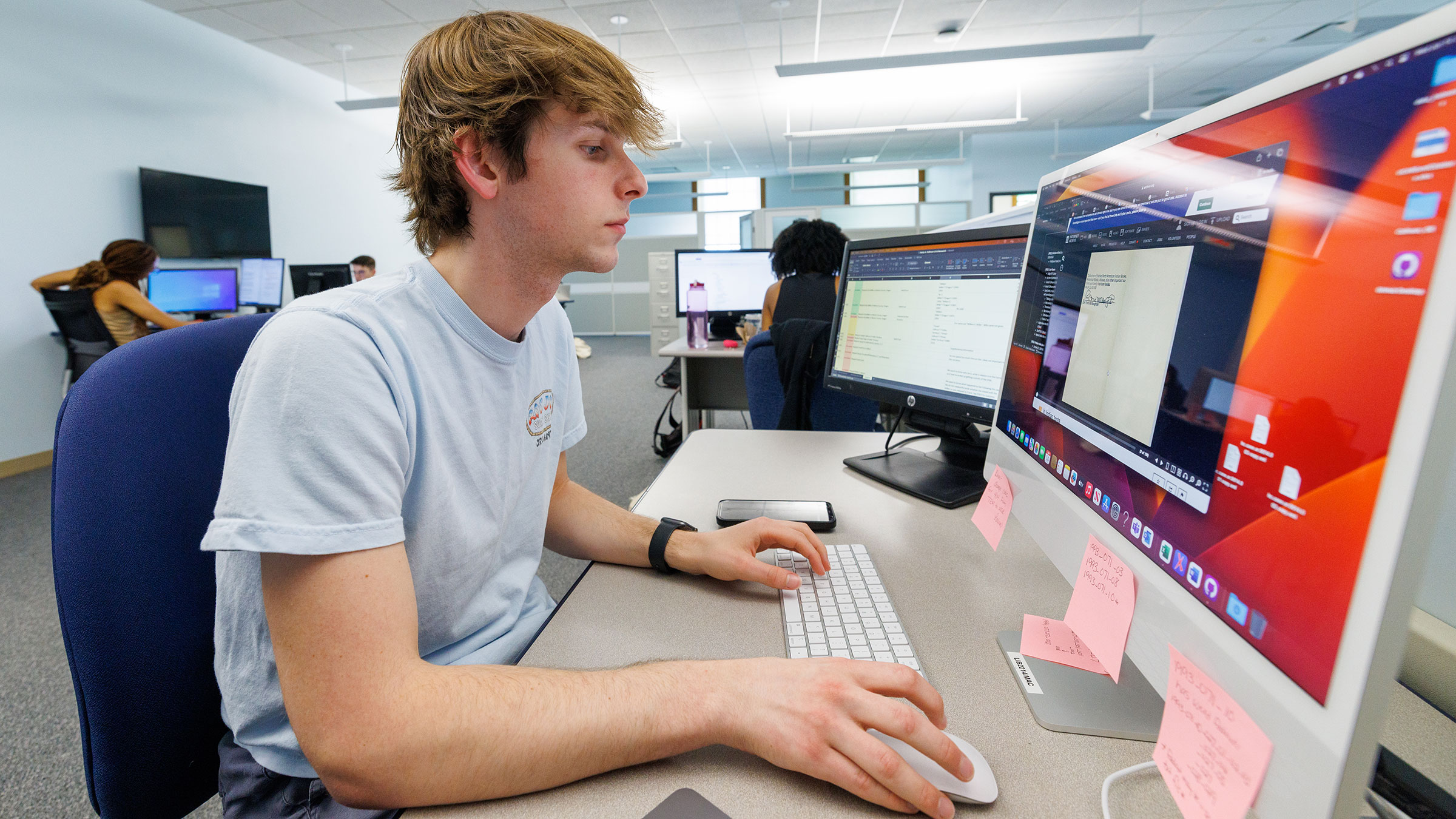 Luke McDermott a sophomore from Omaha and a UCARE student, works on researching a case. 