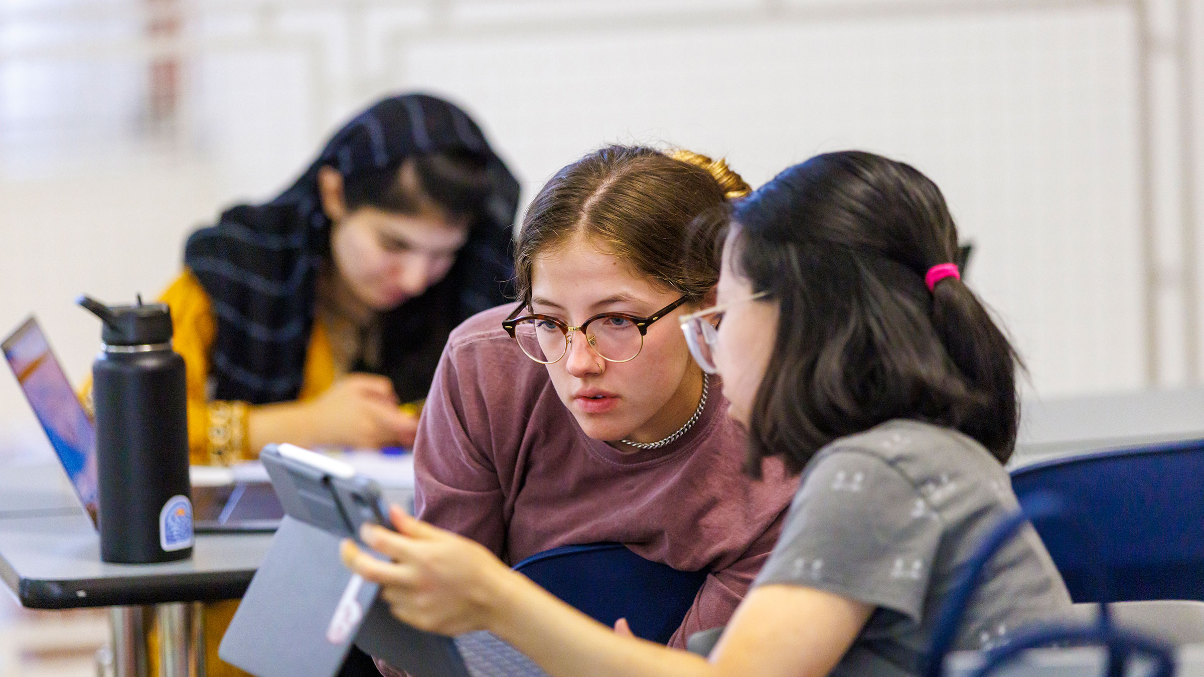 Jorenson students looking at tablet screen