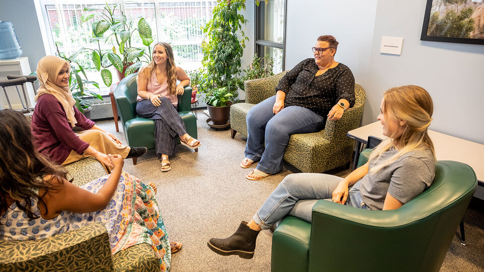 EDPS clinic participants sitting in lounge in circle talking