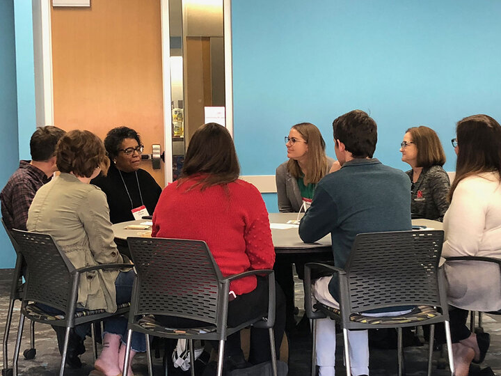 group of navigators having table discussion