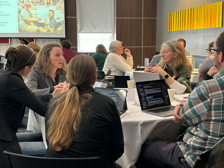 group at table with laptop