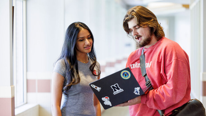 Raikes students with laptop
