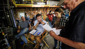 Nebraska student and script supervisor Charlie Major listens to comments by producer Jamie Vesay. At left is Richard Endacott and in the middle right is Grace Birkland, Nebraska student and second assistant cameraperson.